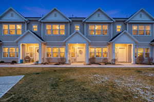 Rear view of property featuring a lawn