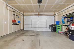 Garage featuring a garage door opener