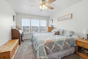 Bedroom featuring carpet flooring and a ceiling fan