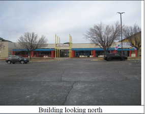 View of commercial location with uncovered parking