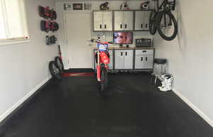 Garage featuring baseboards
