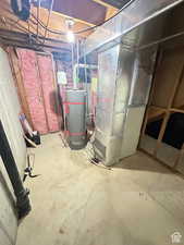 Unfinished basement with water heater and heating unit
