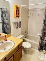 Bathroom with vanity and shower / tub combo