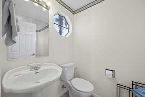 Bathroom featuring toilet and a sink