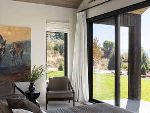 Bedroom with carpet flooring and wood ceiling