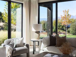 Sunroom / solarium featuring a mountain view