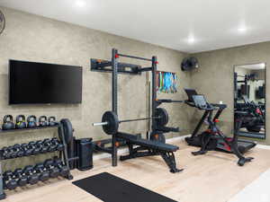 Workout room with wood finished floors