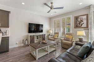 Living room featuring wood finished floors, ceiling fan, and recessed lighting