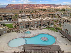 Community pool featuring a mountain view, a patio, and a residential view