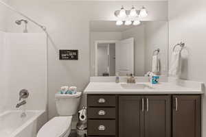 Bathroom with shower / tub combination and vanity