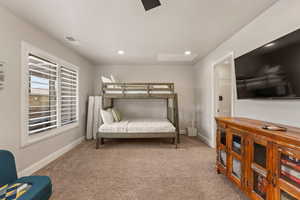 This can be a 4th Bedroom featuring light carpet, a ceiling fan, and recessed lighting