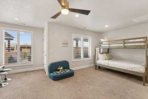 For $3,500 the GC can bulid a wall and add a door in this loft area to create a 4th Bedroom featuring light carpet, a ceiling fan, a textured ceiling, and recessed lighting