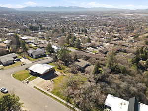 Aerial perspective of suburban area with a mountain backdrop