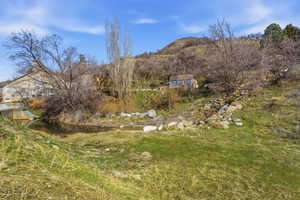 Mountain view featuring a large body of water