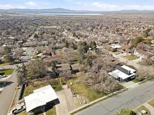 Aerial overview of property's location featuring nearby suburban area and a mountain backdrop