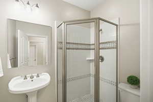 Bathroom with toilet and a shower stall