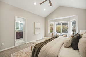 Master bedroom with light carpet, bay windows, ceiling fan, ensuite bathroom, and recessed lighting