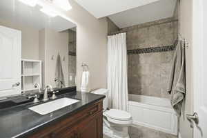Bathroom with vanity and shower / tub combo