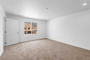 Unfurnished room featuring baseboards and carpet flooring