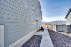 View of side of home featuring a mountain view