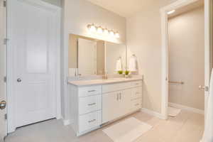 Bathroom featuring vanity and light tile patterned flooring