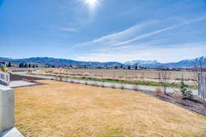 View of yard featuring a view of countryside and a mountain view