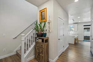 Hallway featuring dark wood-type flooring and recessed lighting