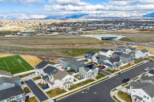 Aerial perspective of suburban area with a mountain backdrop