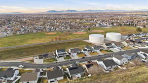 View of property location featuring nearby suburban area and a mountain backdrop
