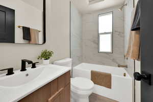 Full bath featuring vanity and shower / bath combination