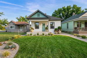 View of front of home featuring a porch and brick siding