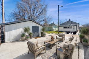View of patio / terrace featuring outdoor furniture and an outdoor structure