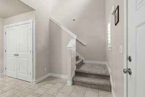 Stairs featuring baseboards