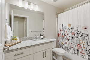 Bathroom featuring toilet and vanity