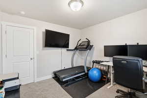 Office area featuring carpet flooring and baseboards