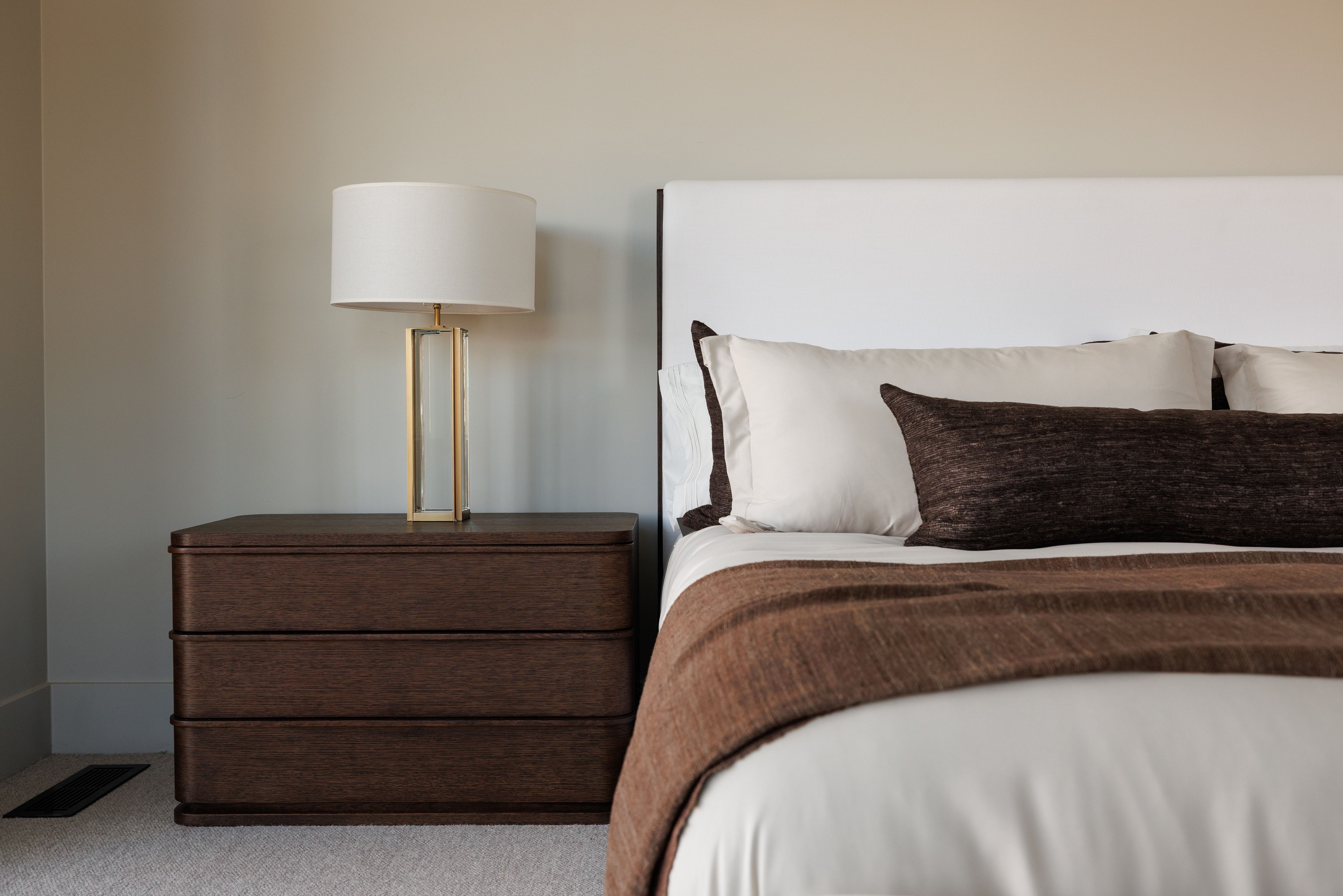 Bedroom featuring light carpet
