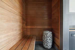 Sauna / steam room featuring wood walls and tile patterned flooring