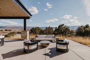 View of patio / terrace with a mountain view and an outdoor lounge area