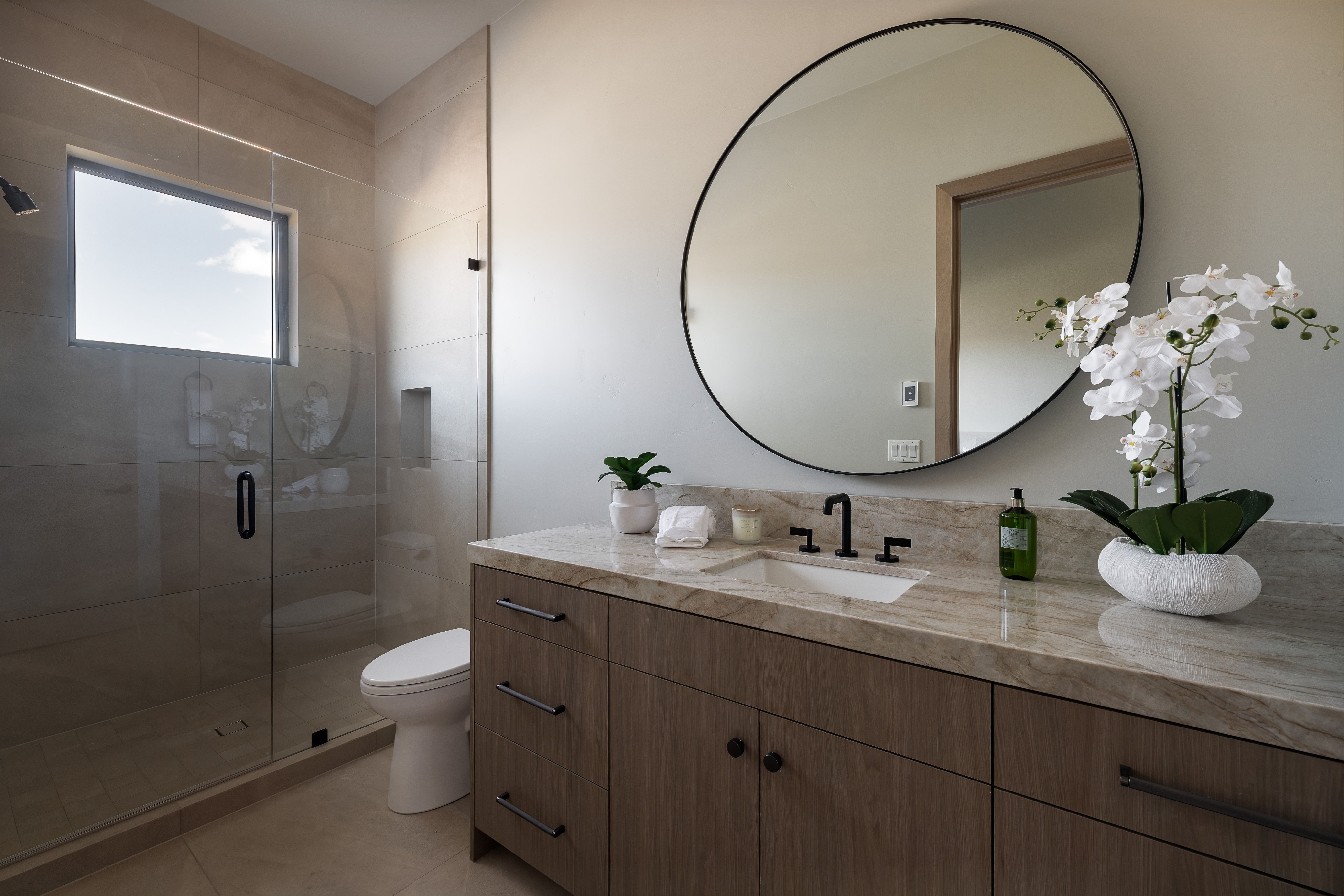 Bathroom featuring vanity and a shower stall