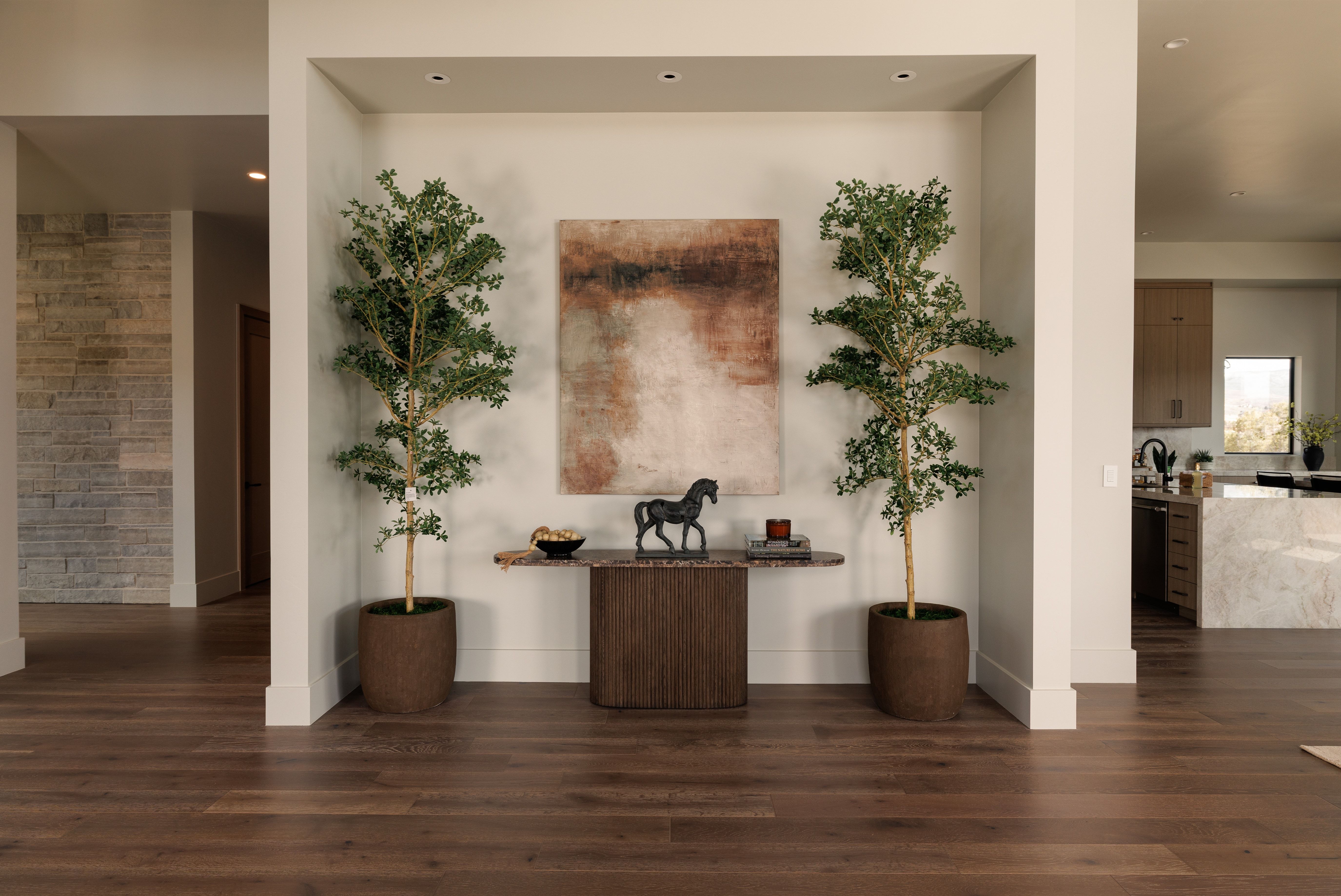 Hallway with dark wood finished floors and recessed lighting