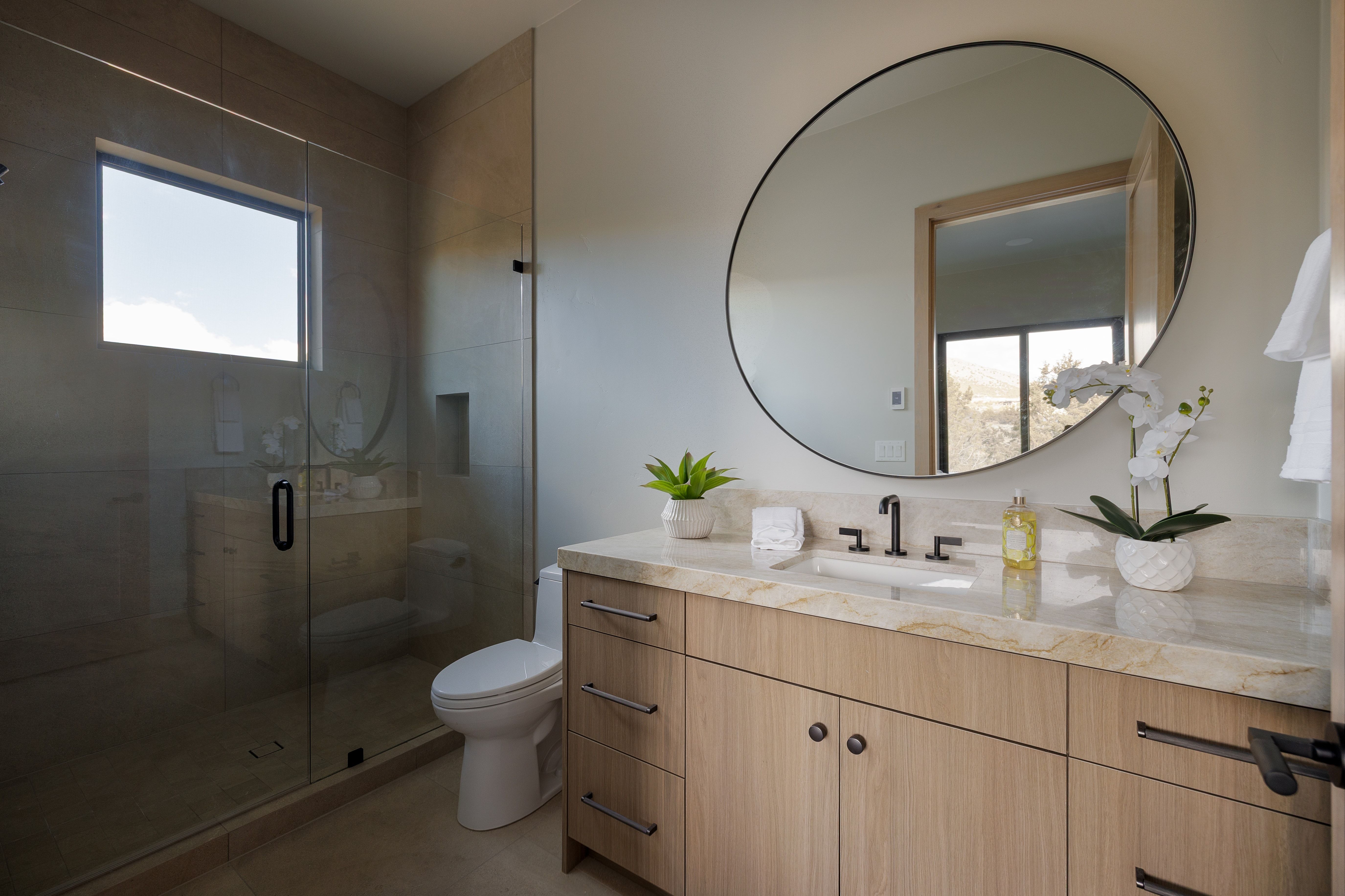 Full bath featuring vanity, a shower stall, and healthy amount of natural light
