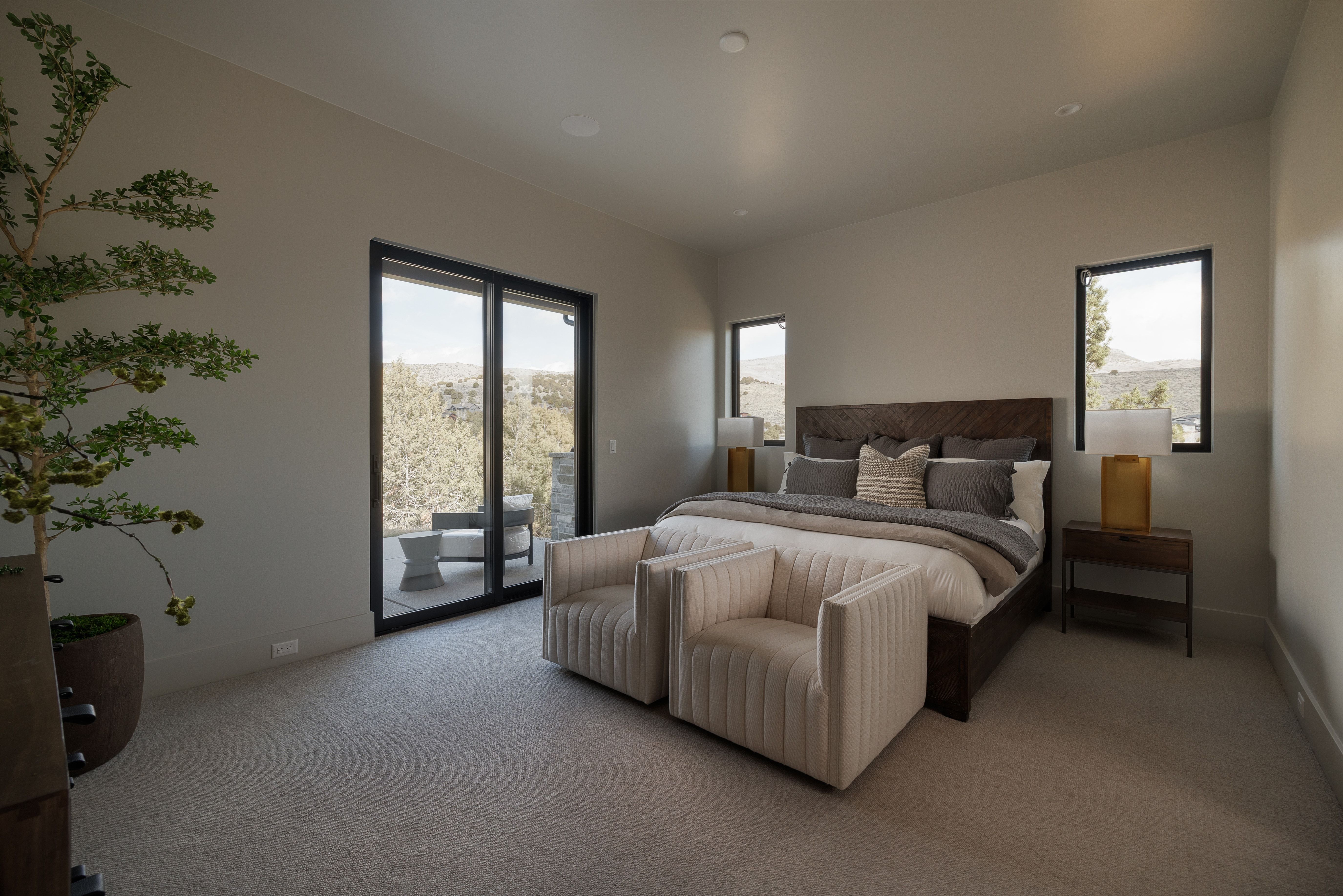 Bedroom with access to exterior and carpet