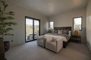 Bedroom with access to exterior and carpet