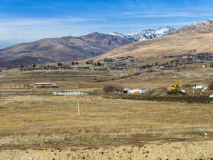 View of mountain backdrop featuring rural landscape