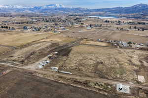 Aerial overview of property's location featuring rural landscape and a mountain backdrop