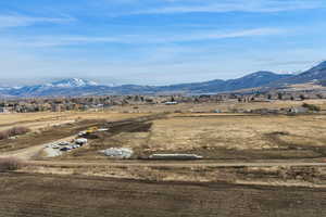 View of mountain backdrop with rural landscape