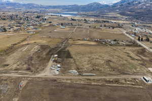 Aerial view of property's location featuring a water and mountain view and rural landscape