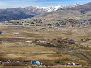 View of mountain backdrop with rural landscape
