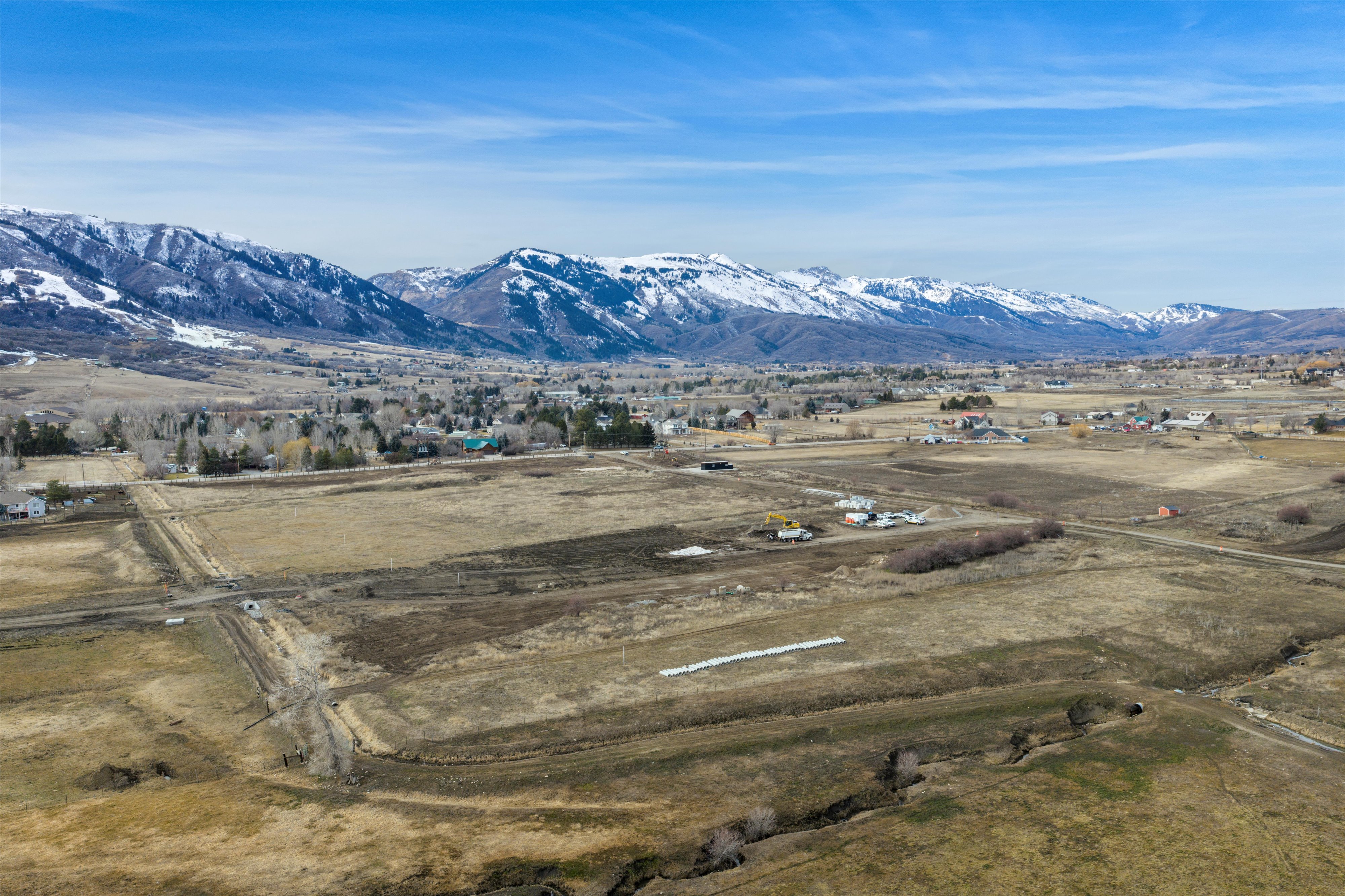 View of mountain backdrop with rural landscape