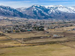 View of mountain background featuring rural landscape